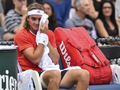 MONTREAL, QC - AUGUST 07: Stefanos Tsitsipas of Greece wipes himself down during stoppage in his match against Hubert Hurkacz of Poland during day 6 of the Rogers Cup at IGA Stadium on August 7, 2019 in Montreal, Quebec, Canada.   Minas Panagiotakis/Getty Images/AFP
== FOR NEWSPAPERS, INTERNET, TELCOS & TELEVISION USE ONLY ==
