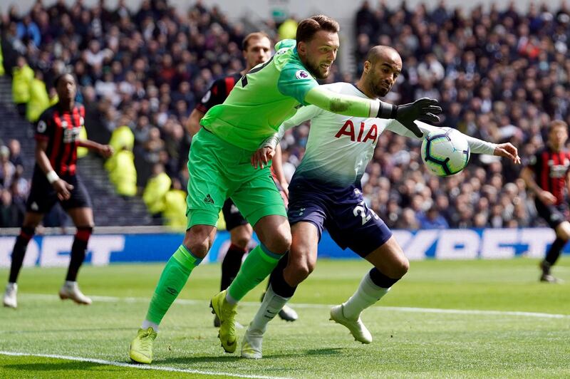 Tottenham's Lucas Moura, right, vies for the ball against Huddersfield goalkeeper. Ben Hamer. EPA