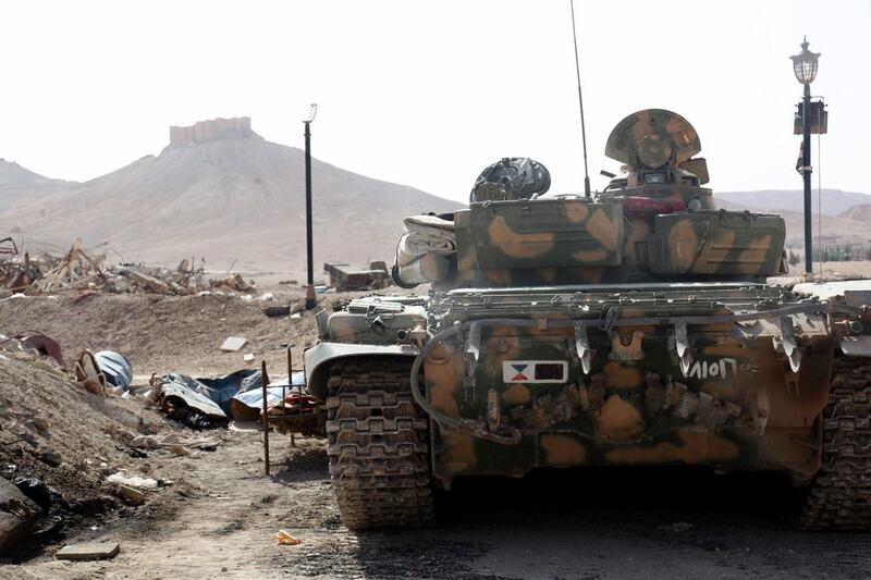 Palmyra bears scars of Syria’s continuing war: clashes between armed rebels and government forces in 2013 left collapsed columns and statues in their wake. Days before its capture, a Syrian armoured tank took up position during battles against ISIL on May 19, 2015. EPA