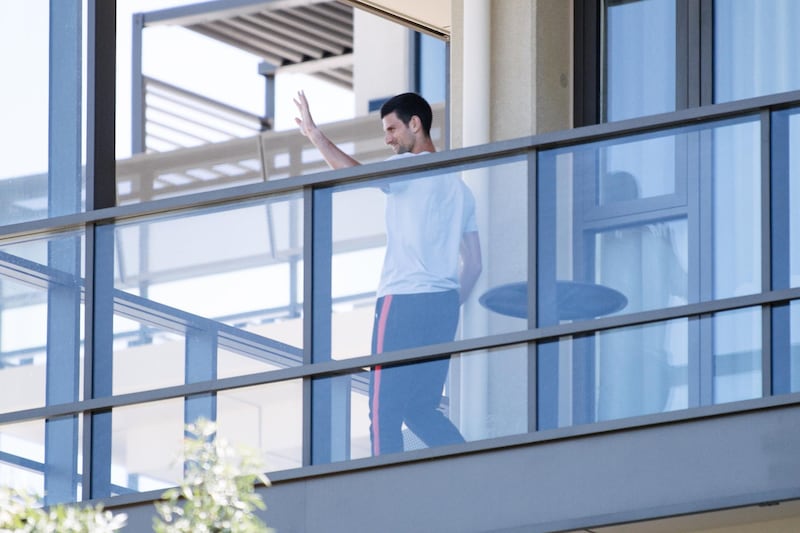 Novak Djokovic on the balcony of the M Suites, where some Australian Open competitors are currently under quarantine after testing positive for Covid-19, in North Adelaide, Australia. EPA