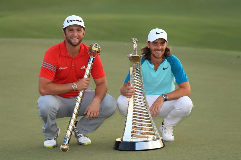 DUBAI, UNITED ARAB EMIRATES - NOVEMBER 19:  Jon Rahm of Spain poses with the trophy and Tommy Fleetwood of England poses with the Race to Dubai trophy during the final round of the DP World Tour Championship at Jumeirah Golf Estates on November 19, 2017 in Dubai, United Arab Emirates.  (Photo by Andrew Redington/Getty Images)