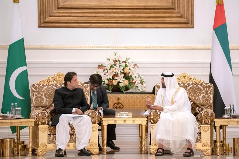 ABU DHABI, UNITED ARAB EMIRATES - September 19, 2018: HH Sheikh Mohamed bin Zayed Al Nahyan Crown Prince of Abu Dhabi Deputy Supreme Commander of the UAE Armed Forces (center R), receives HE Imran Khan Prime Minister of Pakistan (center L), during a reception at the Presidential Airport. 

( Hamad Al Kaabi / Crown Prince Court - Abu Dhabi )
---