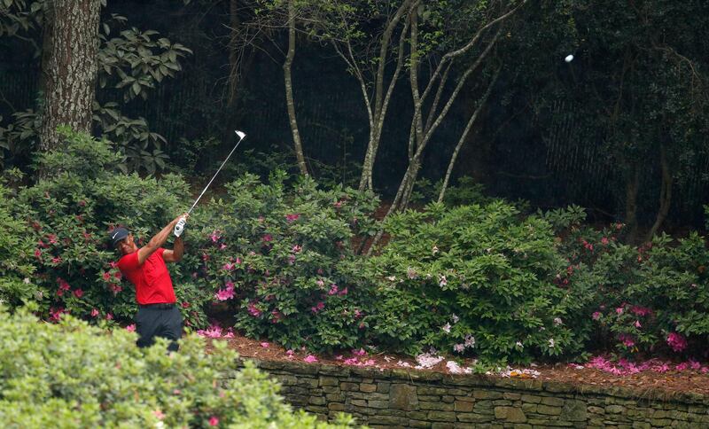 Tiger Woods hits his tee shot on the 13th hole during the final round at Augusta. Justin Lane / EPA
