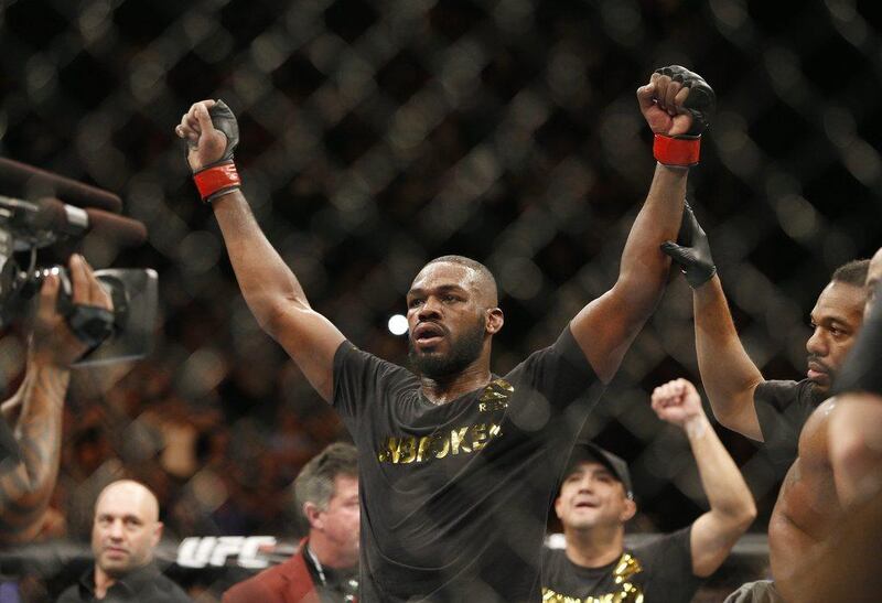 Jon Jones celebrates after defeating Daniel Cormier during their light heavyweight title fight on Saturday at UFC 182 in Las Vegas. John Locher / AP