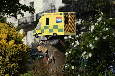 BRIGHTON, ENGLAND - MAY 02: Artwork thanking the NHS sits on a tree stump in a Brighton square on May 02, 2020 in Brighton, England. British Prime Minister Boris Johnson, who returned to Downing Street this week after recovering from Covid-19, said the country needed to continue its lockdown measures to avoid a second spike in infections. (Photo by Mike Hewitt/Getty Images)