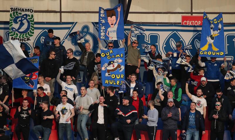 Fans cheer as they watch the  match between FC Minsk and FC Dinamo-Minsk. EPA