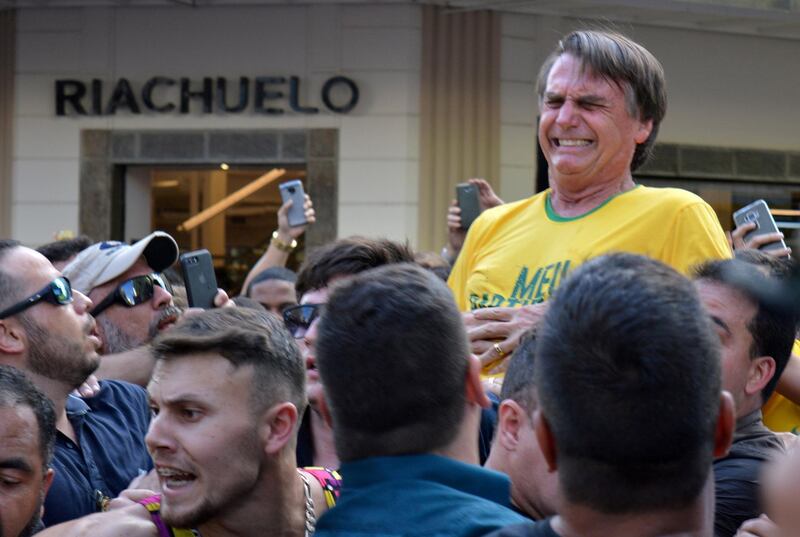 FILE PHOTO: Brazilian presidential candidate Jair Bolsonaro reacts after being stabbed during a rally in Juiz de Fora, Minas Gerais state, Brazil September 6, 2018. REUTERS/Raysa Campos Leite/File photo