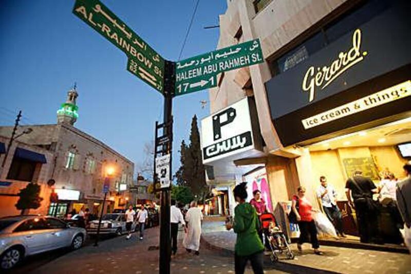 Signposts in Amman show the street names in Arabic and English as well as the numbers of buildings nearby.