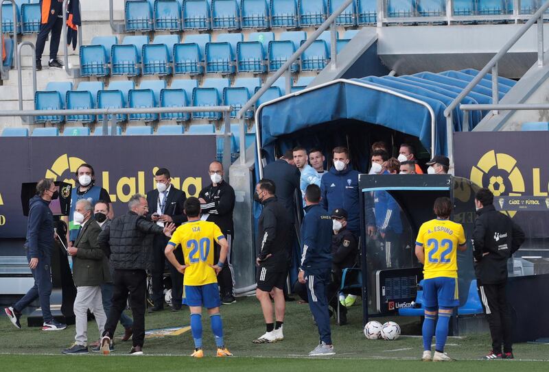 Valencia players leave the pitch after teammate Mouctar Diakhaby allegedly received a racist comment by Cadiz defender Juan Cala. EPA