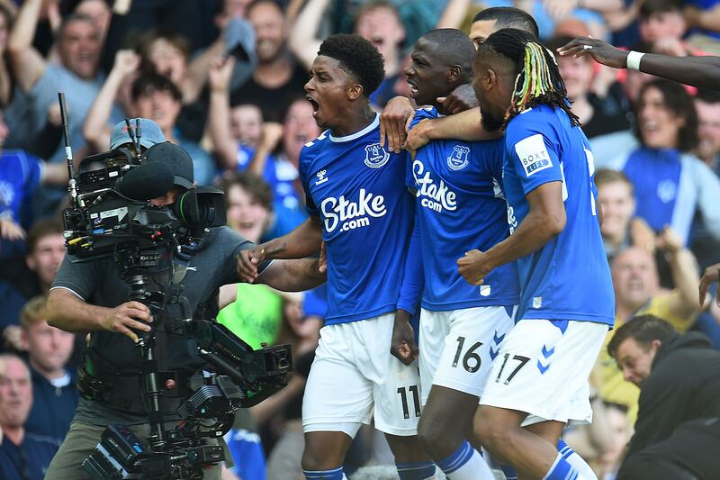 Everton's French midfielder Abdoulaye Doucoure, second left, celebrates with teammates after scoring against Bournemouth at Goodison Park on Sunday, May 28, 2023. AFP