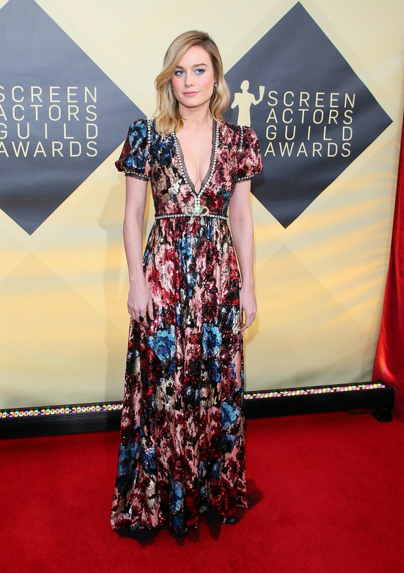 Brie Larson's Gucci gown brings the glitz but also has a lovely vintage nod to it with the sharp sleeves and classic silhouette. Jean-Baptiste Lacroix / AFP