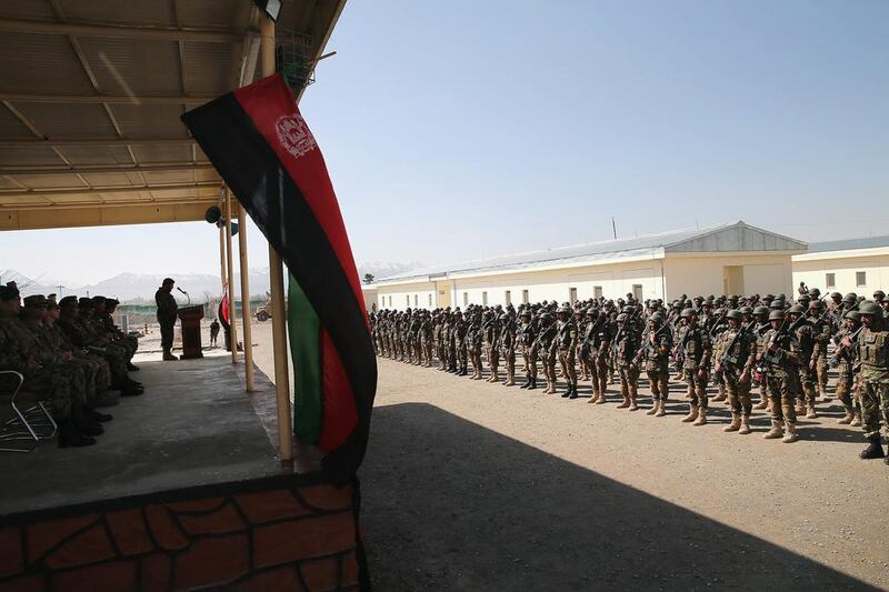 Soldiers with the Afghan National Army graduate from basic training during a ceremony at the ANA’s combined fielding centre in Kabul. Scott Olson / Getty / March 18, 2014