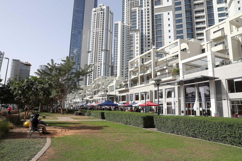 DUBAI , UNITED ARAB EMIRATES , January 18 – 2019 :- View of the residential towers and shopping area at the Bay Avenue in Business Bay in Dubai. (Pawan Singh / The National ) For News/Online/Instagram. Story by Patrick