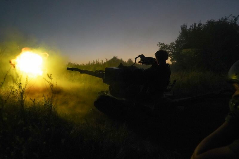 Ukrainian servicemen fire at Russian positions in Kharkiv region. AP