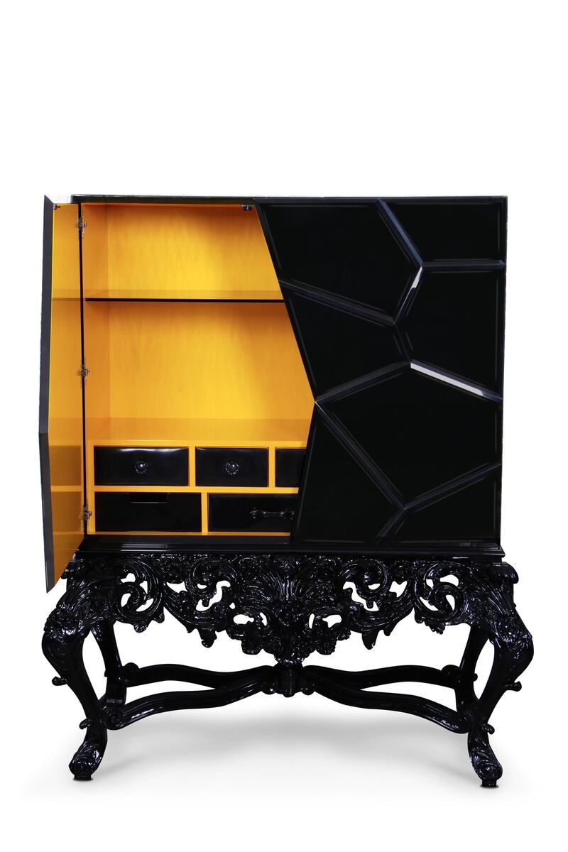 Paint the interior of a cabinet yellow for a cheerful surprise each time you open it. Seen here, the Victoria cabinet from Boca do Lobo