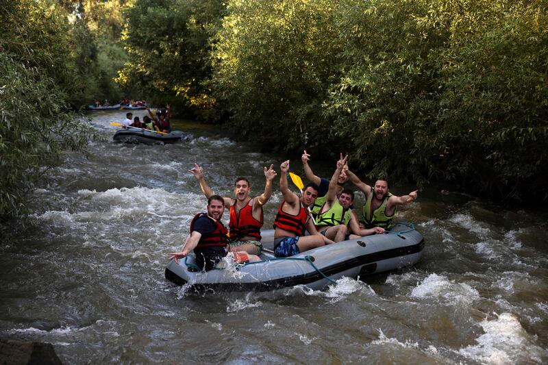 People practise rafting near the northern Kibbutz Gadot in the northern part of the Jordan River. AFP