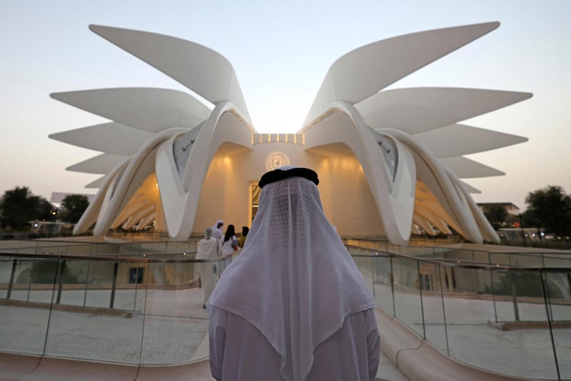 A visitor stands outside the Emirates Pavilion on the last day of Expo 2020 Dubai on March 31. AFP