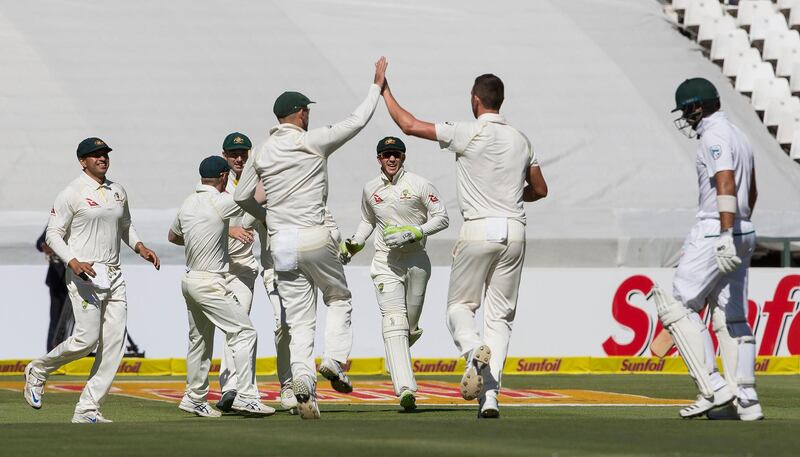 The Australian team celebrates at the taking of the wicket of Aiden Markram on the opening day of the third Test in Cape Town. Halden Krog / AP Photo