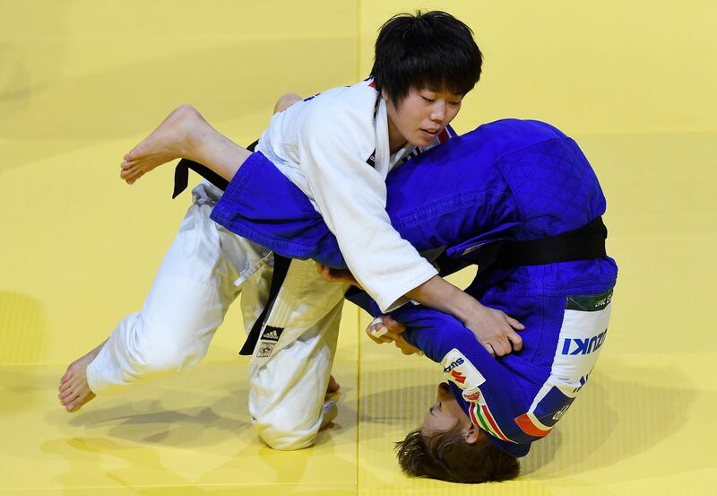 Reka Pupp, in blue, of Hungary and Song Sim Rim of North Korea fight in the women's 52kg category of the Judo World Championships in Budapest, Hungary. Tamas Kovacs / MTI via AP
