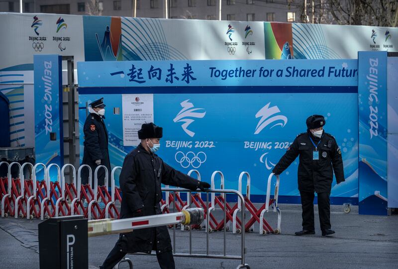 Guards secure the gates and barriers at a hotel that is part of the closed loop bubble to protect against the spread of Covid-19 at the Beijing 2022 Winter Olympics. Getty