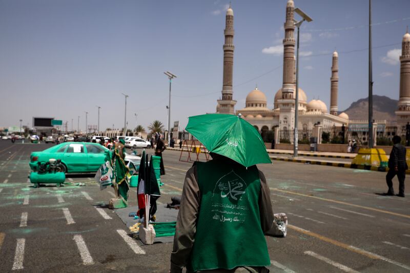 The day after a UN-brokered truce expired, drivers in Sanaa, Yemen, have their vehicles decorated in green to celebrate Prophet Mohammed's birthday.  EPA