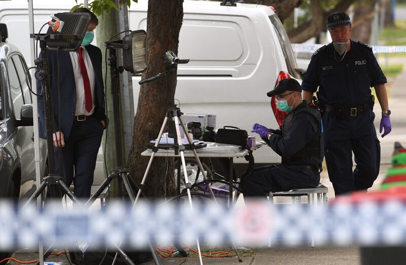 Police search for evidence at a block of flats in the Sydney suburb of Lakemba. William West.