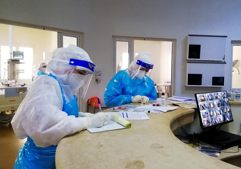 Medical staff work inside an intensive care department for patients suffering from the coronavirus disease (COVID-19), at a hospital in Ariana, Tunisia, April 26, 2021. Picture taken April 26, 2021. REUTERS/Jihed Abidellaoui