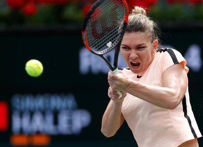 epa06601371 Simona Halep of Romania in action against Wang Qiang of China during the BNP Paribas Open at the Indian Wells Tennis Garden in Indian Wells, California, USA, 13 March 2018.  EPA/JOHN G. MABANGLO