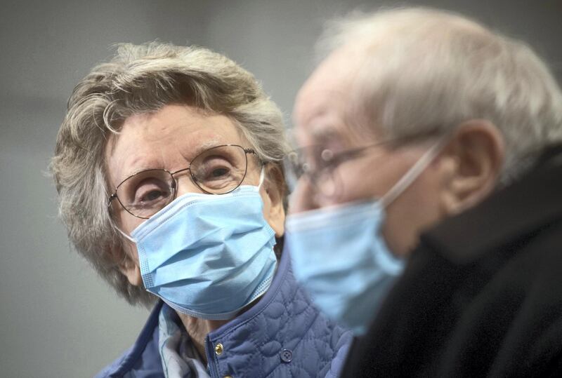 Geoff Holland, 90, and Jenny Holland, 86, are seen after receiving their injections of the AstraZeneca COVID-19 vaccine at a former Wickes store which is being used as a covid vaccination centre in Mansfield, Britain January 25, 2021. The couple, who met in a sheltered housing complex, were due to get married last April but had to postpone their wedding twice due to lockdown restrictions. They eventually held their ceremony in August. Joe Giddens/Pool via REUTERS