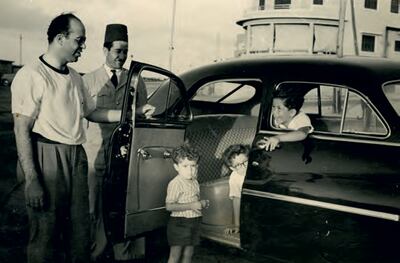 A young Mohamed and his brothers Ismail and Youssef, with their father Loutfy and driver, exploring one of his many classic cars. Photo: The Mansour Family