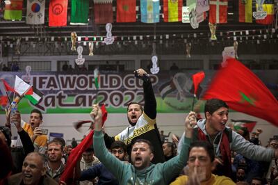 Palestinians in Gaza support Morocco during the match against Spain, on Tuesday. AFP