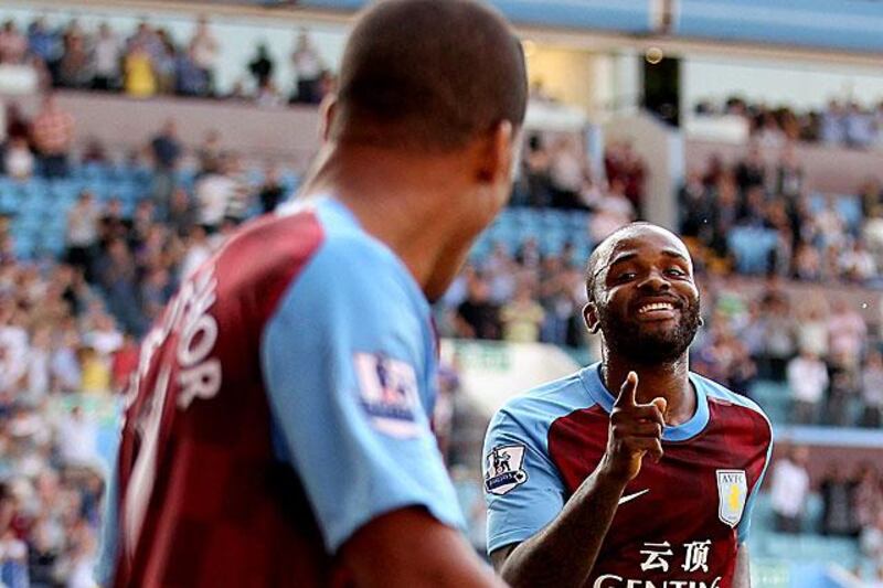 Darren Bent, right, celebrates scoring with fellow Aston Villa striker Gabriel Agbonlahor during their 2-0 win at home to Wigan.

Scott Heavey / Getty Images