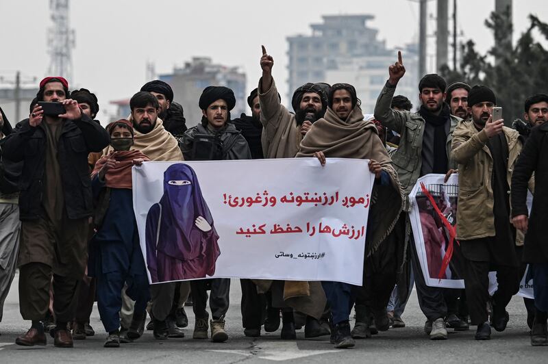 Men march in Kabul, Afghanistan, in a counter-demonstration to condemn a recent protest by Afghan women’s rights activists. AFP