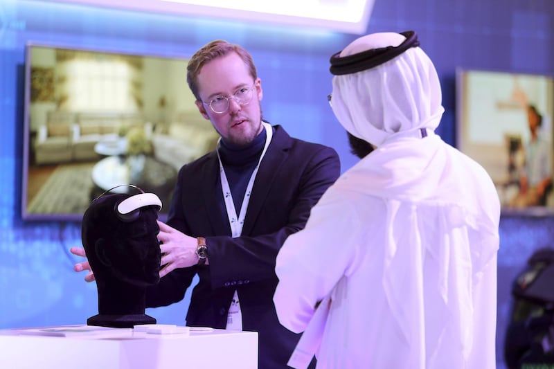  DUBAI , UNITED ARAB EMIRATES , JAN 15 – 2018 :- Daniel Mansson , CEO Flow Neuroscience ( center ) explaining about the Flow Neuroscience medication – free depression treatment to the visitor during the Dubai Health Forum held at Madinat Jumeirah in Dubai.  (Pawan Singh / The National) For News. Story by Nick Webster 
