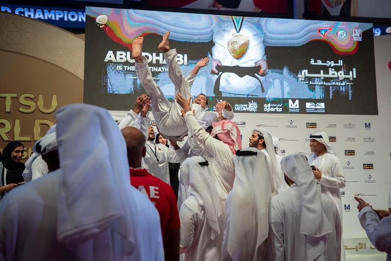Faisal Al Ketbi is thrown up in the air by his fans after winning gold in the 94kg final at the JJIF World Championship at the Mubadala Arena on Friday. Courtesy Shivanna Gowda