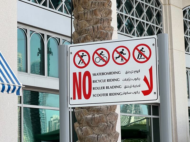 Signs have been erected in Dubai Marina Walk and Marina Mall Walk warning riders they must dismount. Rory Reynolds / The National
