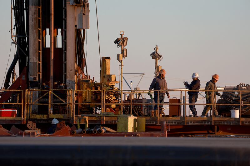 Workers on an oil drilling rig in Stanton, Texas. US crude stocks increased by 2.4 million barrels last week, the US Energy Information Administration said. AFP