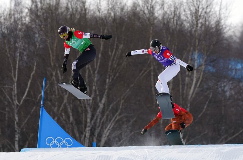 USA's Lindsey Jacobellis, left, on her way to winning the women's snowboard cross final ahead of France's Chloe Trespeuch in the Beijing 2022 Winter Olympics Games at the the Genting Snow Park. PA
