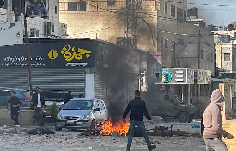 Palestinian stone-throwers gather amid confrontations with Israeli troops during a raid in Jenin in the occupied West Bank. Reuters