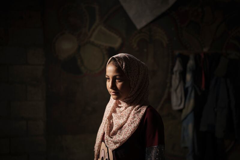 Lama Sihweil, 14, poses for a portrait in her house in Beit Hanoun, northern Gaza Strip. AP