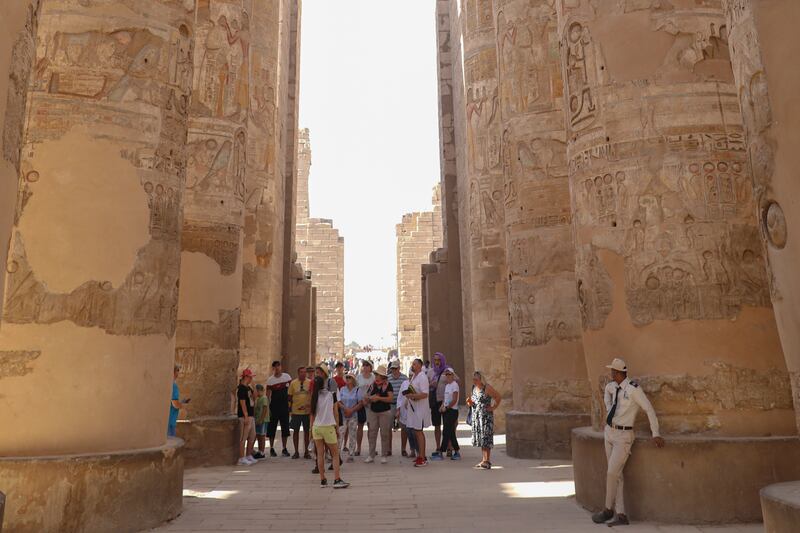 Tourists visit the Karnak Temple, a day after the reopening of the Avenue of Sphinxes, in 2021. AP 