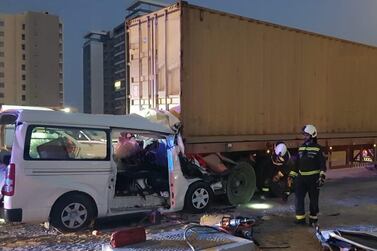 The minibus was partially crushed when it hit a stationary lorry on the hard shoulder of Sheikh Mohamed bin Zayed Road on Monday. Dubai Police