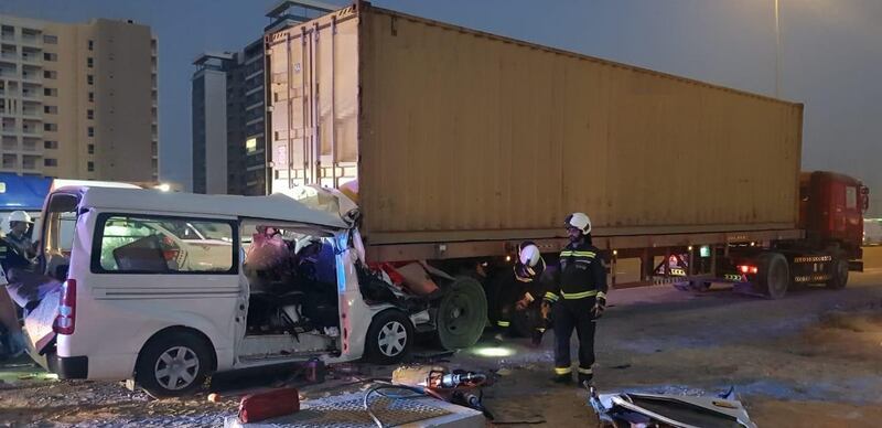 The minibus was partially crushed when it hit a stationary lorry on the hard shoulder of Sheikh Mohamed bin Zayed Road on Monday. Dubai Police