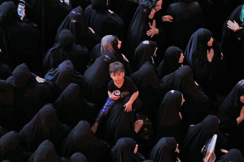 Shiite Muslim women attend a ceremony commemorating the burial of Imam Hussein, in the holy city of Karbala, Iraq. AFP