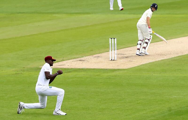 West Indies' captain Jason Holder, left, takes the catch to dismiss England counterpart Joe Root for 23. AP