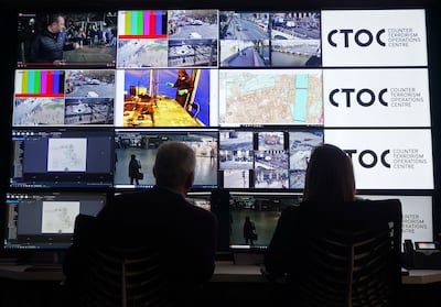 A wall of screens displaying surveillance camera footage at the Counter Terrorism Operations Centre in London. PA 