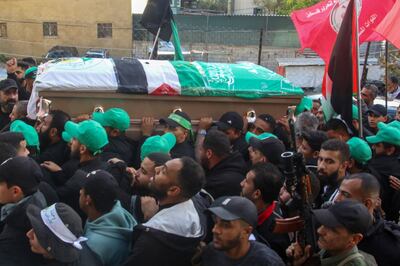 Mourners carry the coffin of Ahmed Hammoud, killed alongside Saleh Al Arouri, in Burj Al-Shamali camp, southern Lebanon. AFP