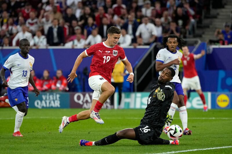 FRANCE RATINGS: Wasn't found wanting when called into action. Got out quickly to save well from Baumgartner. Hurt when making a fearless save at the same player's feet. AP