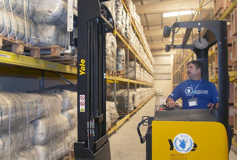 Ali Goahr, a forklift operator for the United Nations World Food Programme, moves blankets in the World Food Programme Warehouse in International Humanitarian City, Dubai, UAE Monday November 18, 2013.
Similar blankets were recently shipped to the Phillipines to aid victims of Typhoon Haiyan.

Credit: Kevin J. Larkin for The National