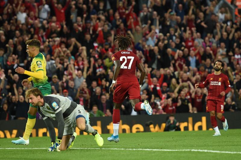 Liverpool striker Divock Origi celebrates after he scores the team's fourth goal. AFP